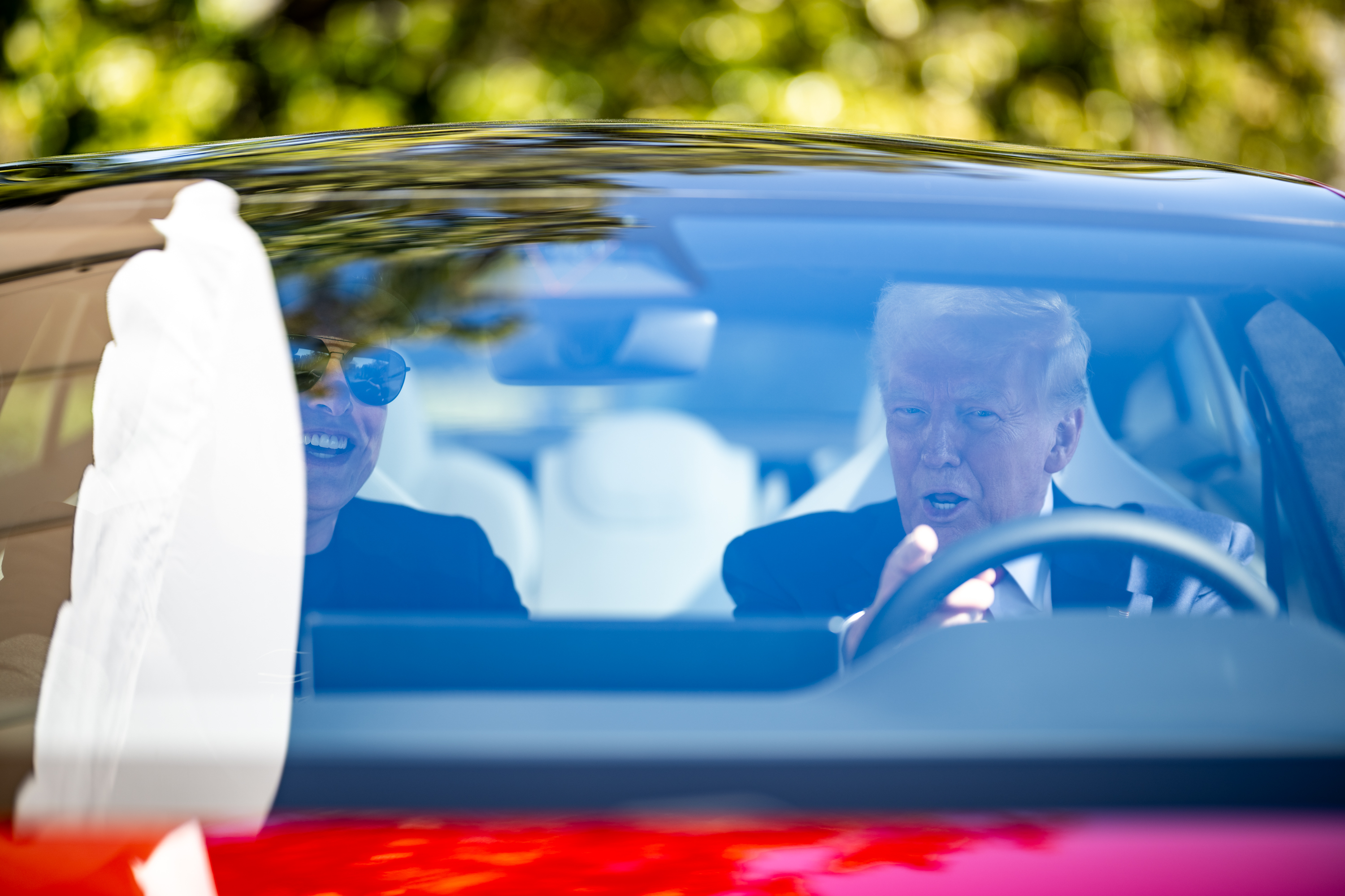 President Trump and Elon Musk in a Tesla